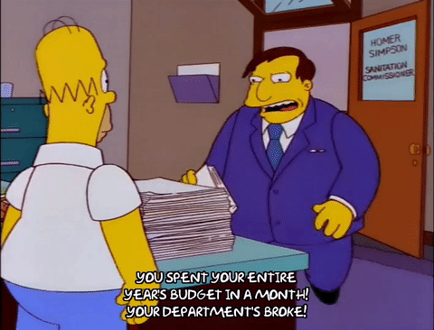 Homer Simpson being told he spent the entire year’s budget in a month, used to illustrate poor IT budgeting habits.