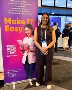 Rav from Cloud Context standing beside a “Make IT Easy” banner at the Digital NSW Showcase event.