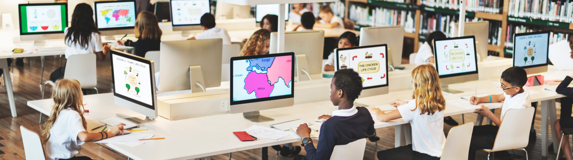 Students using computers in a school library during an ICT lesson in an Australian classroom, illustrating some of the IT challenges Australian schools face