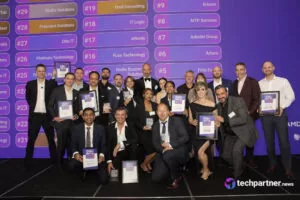 Group photo of 2025 Fast50 award winners on stage at W Hotel Sydney in front of the rankings screen.