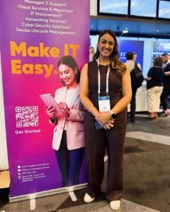 Rav from Cloud Context standing beside a “Make IT Easy” banner at the Digital NSW Showcase event.